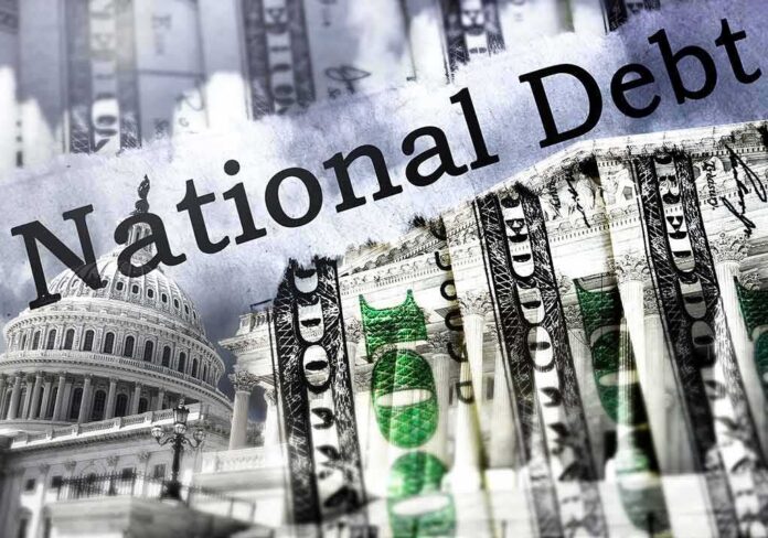 shutterstock_2144536235 U.S. Capitol and dollar bills collage on national debt theme