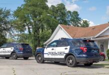 Celebrity Home Stormed – Attempted Murder Case Two police SUVs parked near a suburban house
