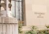Texas PAC Rocked By Vote-Buying Probe Department of Justice building facade with stone sign and window