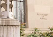 Department of Justice building facade with stone sign and window