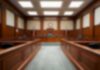 $55M Crypto Grab Backfires – Guilty Empty courtroom with wooden benches and judge's bench