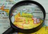 Election Shock Rocks Caracas Magnifying glass over a map of northern South America
