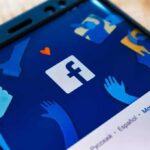 Smartphone screen showing Facebook app logo and icons